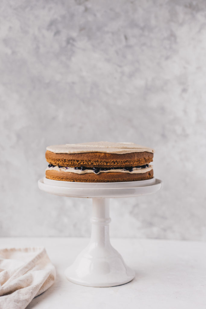 naked cake on a stand photography