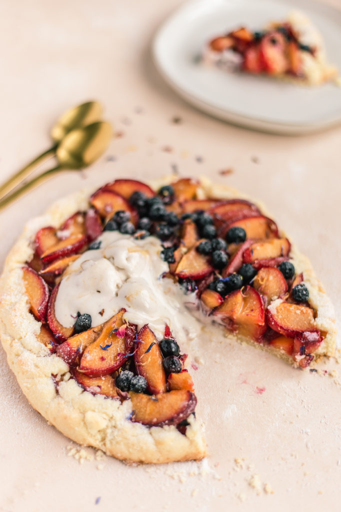Gluten-Free Plum and Blueberry Galette with dollop of ice cream photography