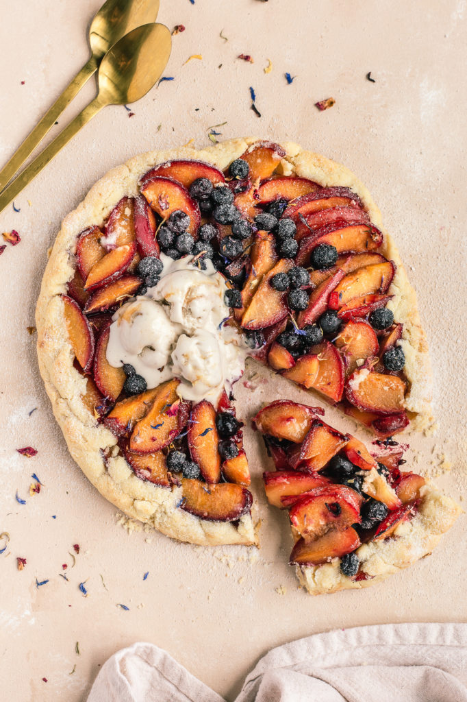 Gluten-Free Plum and Blueberry Galette with dollop of ice cream photography