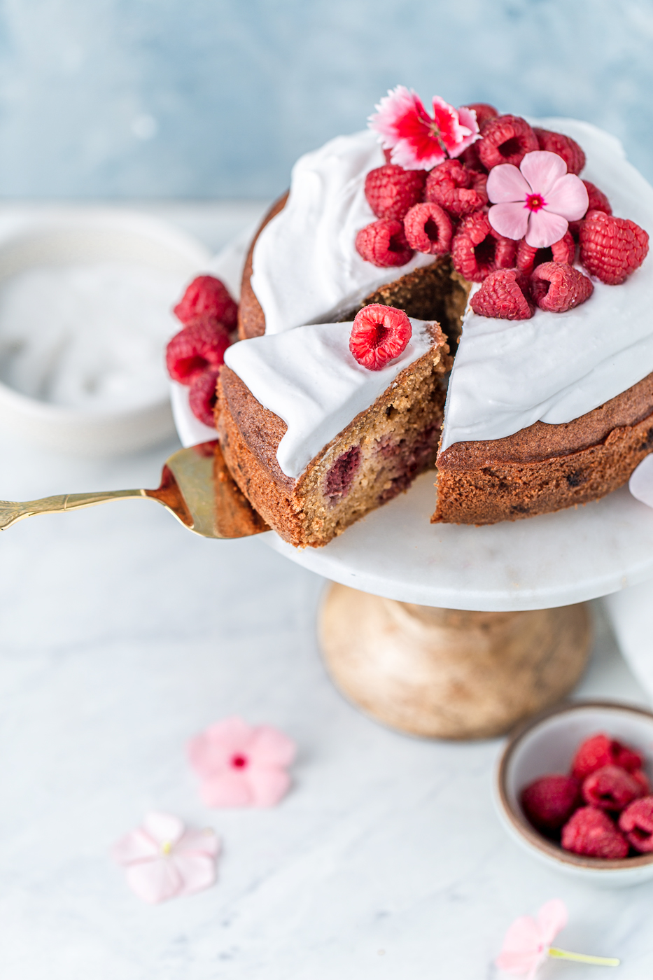 Paleo cake with cream and raspberries photography