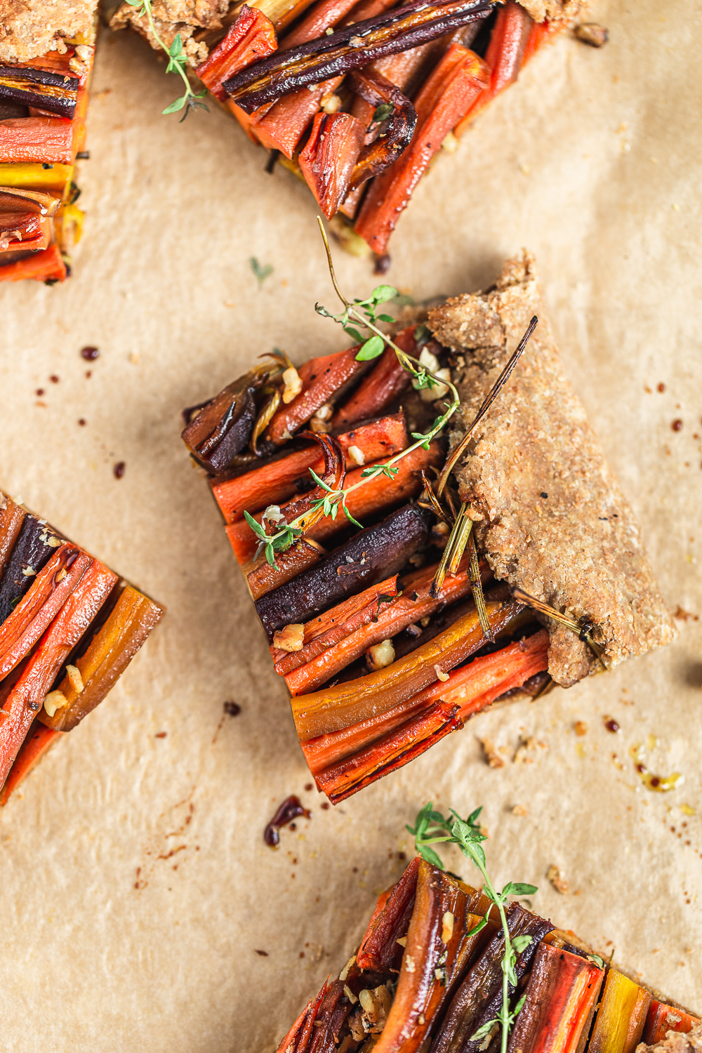 slice of Roasted Carrot Galette with thyme and walnuts food photography