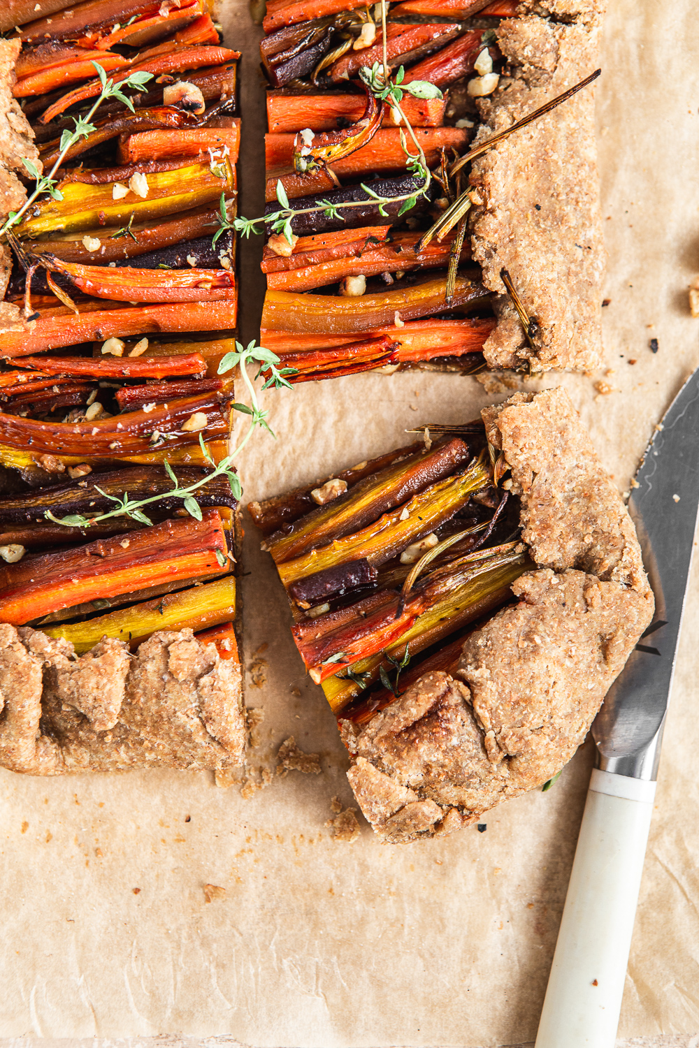 sliced Carrot Galette with thyme and walnuts food photography