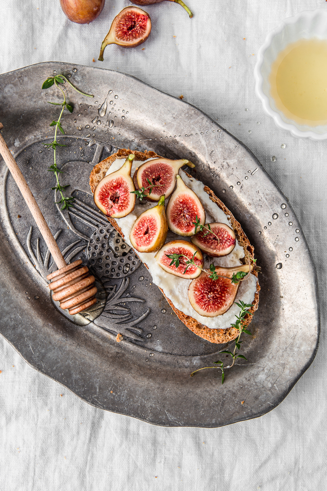 non dairy cream cheese toast with figs and drizzle of honey photography