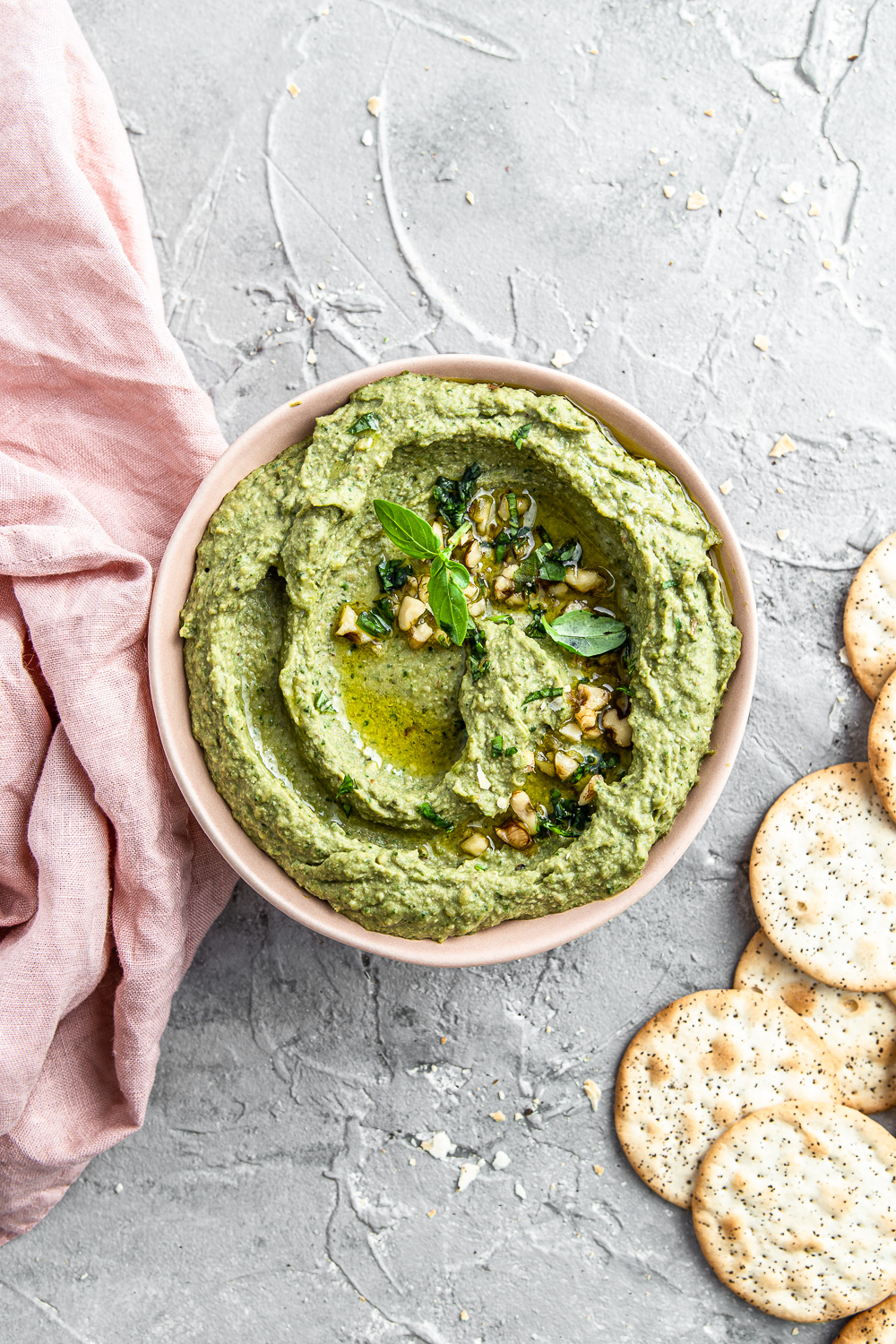 green kale dip with walnuts basil and crackers food photography