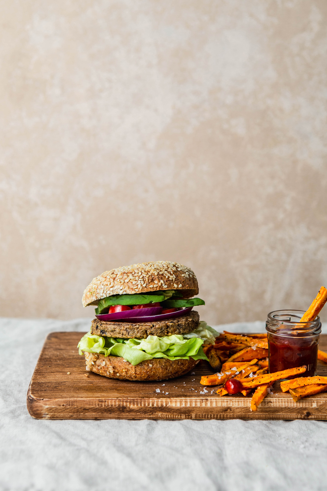 vegan veggie burger with sweet potato fries and ketchup photography