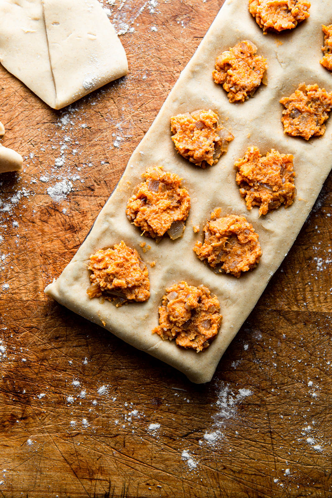 vegan homemade ravioli with sweet potato filling on a wooden board food photography